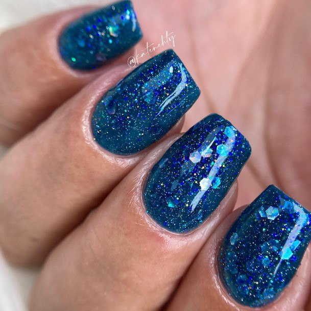 Neat Blue Glitter Nail On Female