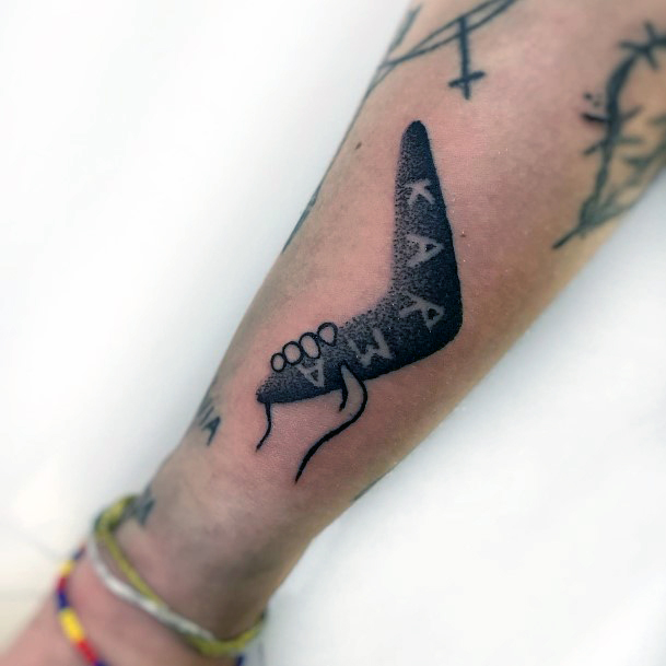 Neat Boomerang Tattoo On Female