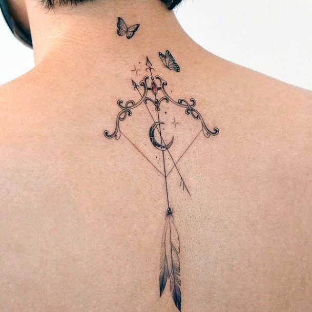 Neat Bow And Arrow Tattoo On Female