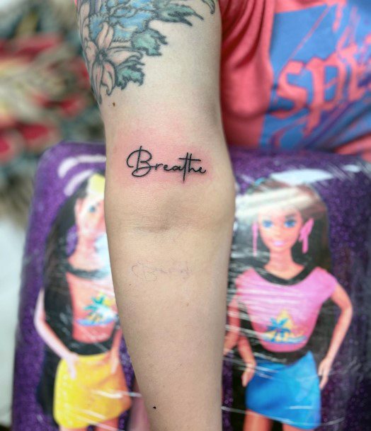 Neat Breathe Tattoo On Female