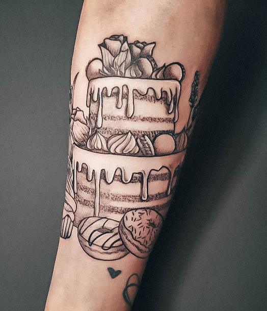 Neat Cake Tattoo On Female