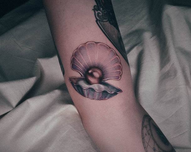 Neat Clam Tattoo On Female