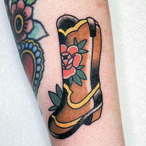 Neat Cowboy Boot Tattoo On Female