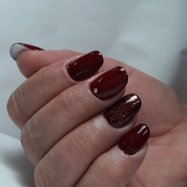 Neat Dark Maroon Nail On Female