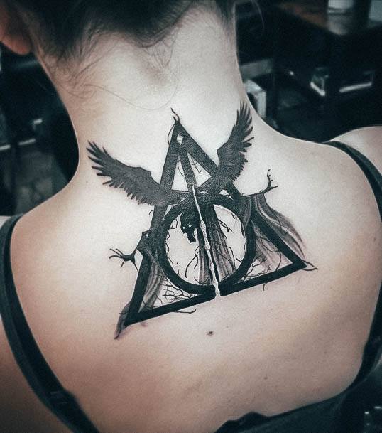 Neat Deathly Hallows Tattoo On Female