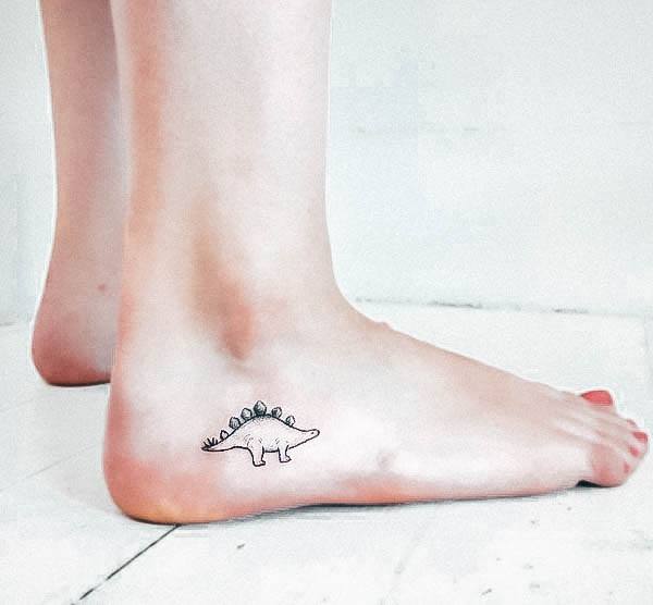 Neat Dinosaur Tattoo On Female