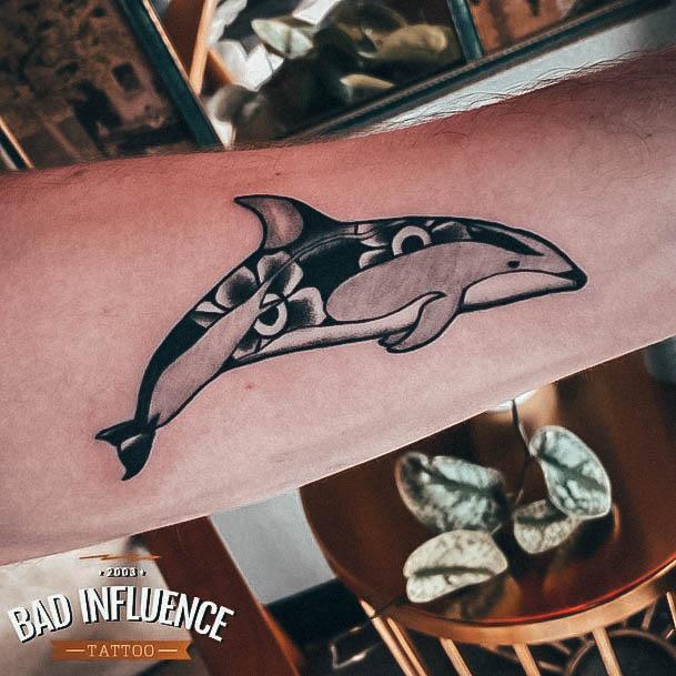 Neat Dolphin Tattoo On Female