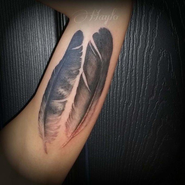 Neat Eagle Feather Tattoo On Female