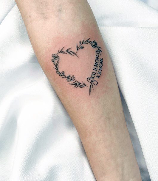 Neat Flower Heart Tattoo On Female