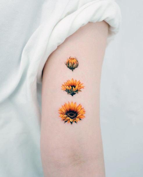 Neat Flower Petal Tattoo On Female