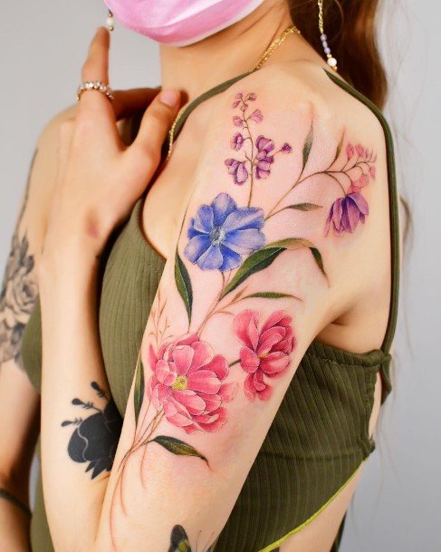 Neat Flower Shoulder Tattoo On Female