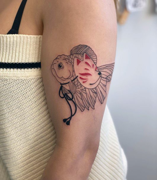 Neat Goldfish Tattoo On Female