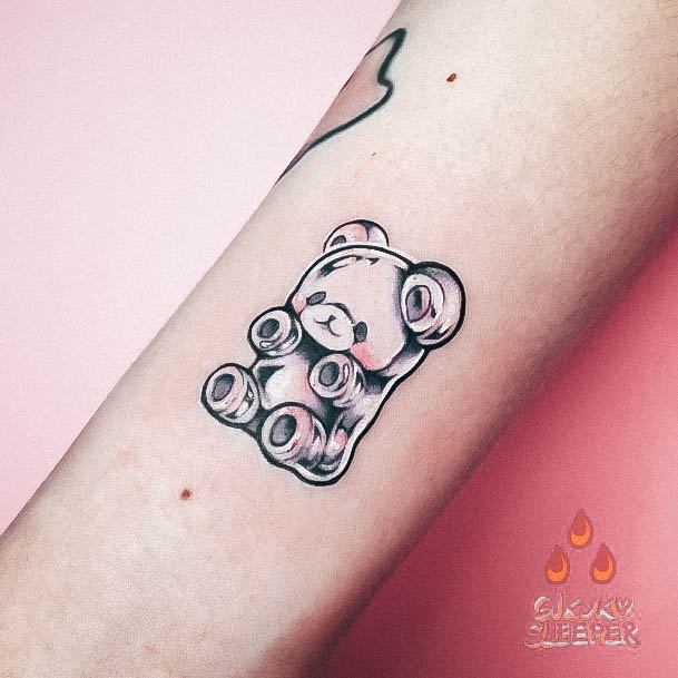 Neat Gummy Bear Tattoo On Female White Ink