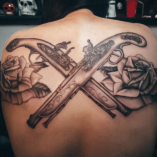 Neat Gun Tattoo On Female