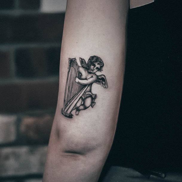 Neat Harp Tattoo On Female