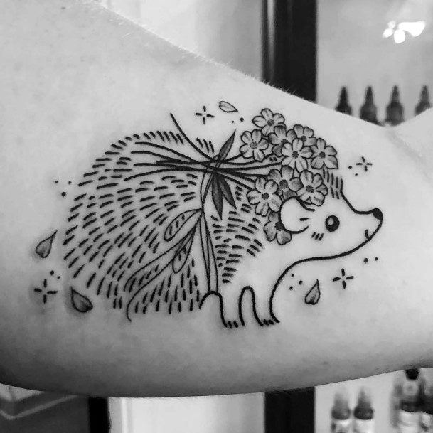 Neat Hedgehog Tattoo On Female