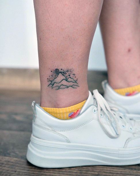 Neat Hiking Tattoo On Female