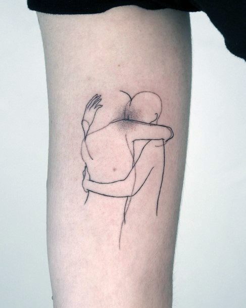 Neat Hug Tattoo On Female