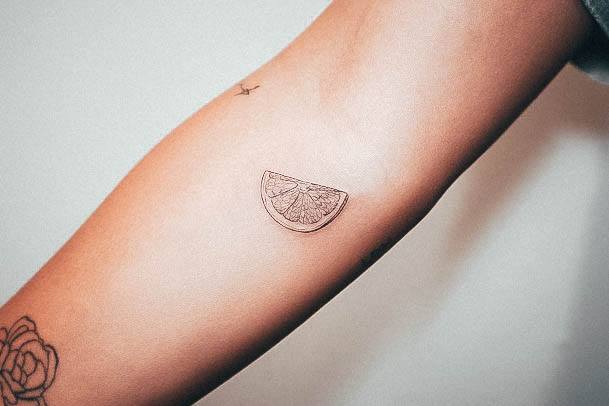 Neat Lemon Tattoo On Female