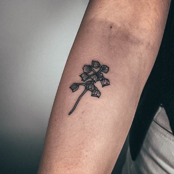 Neat Lily Of The Valley Tattoo On Female