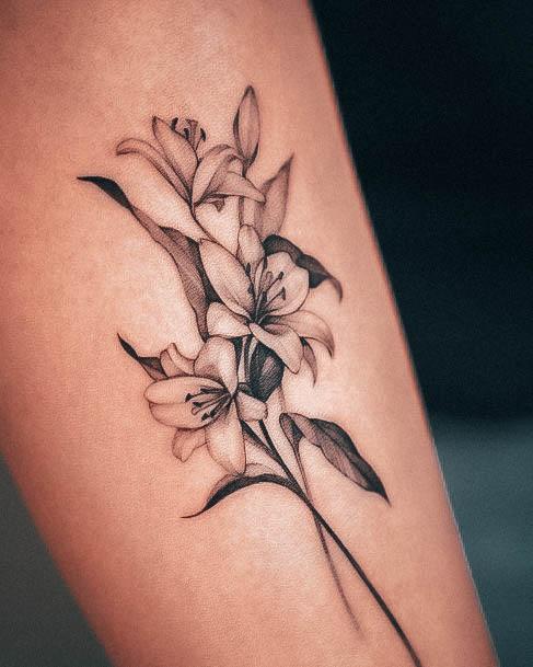 Neat Lily Tattoo On Female