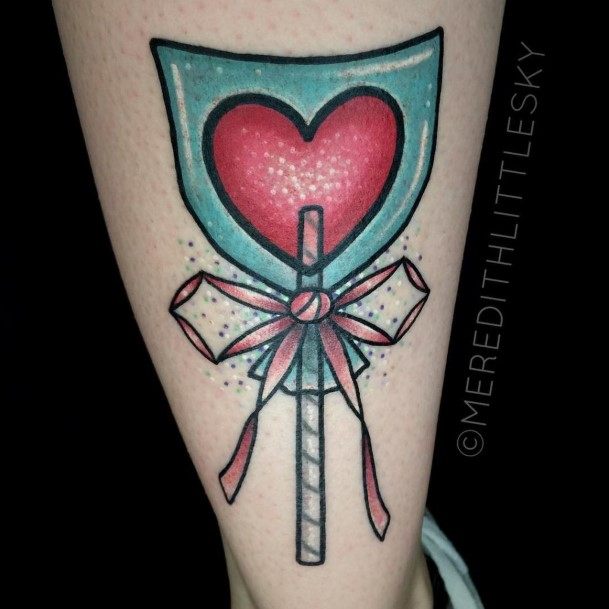 Neat Lollipop Tattoo On Female