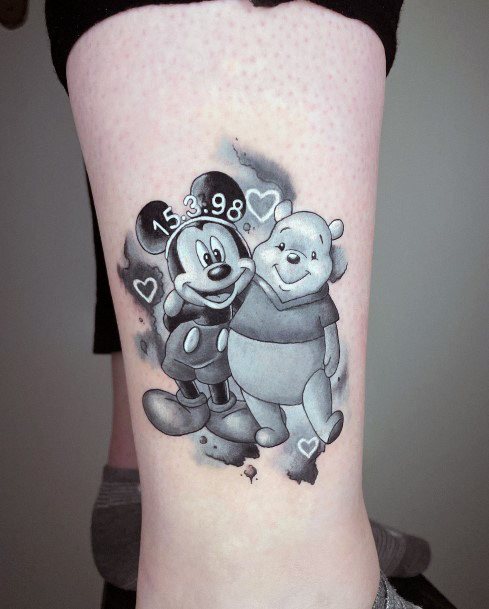 Neat Mickey Mouse Tattoo On Female