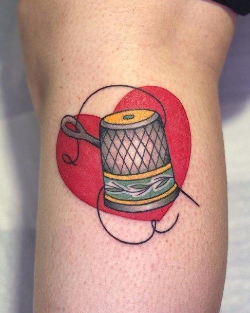 Neat Needle And Thread Tattoo On Female