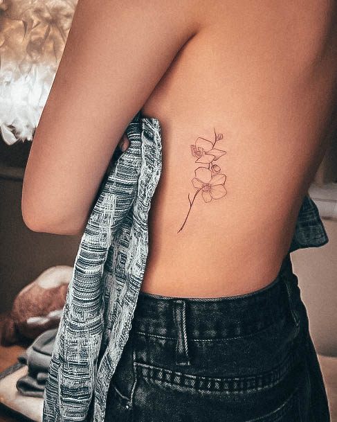 Neat Orchid Tattoo On Female