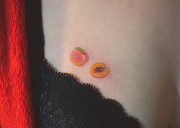 Neat Peach Tattoo On Female