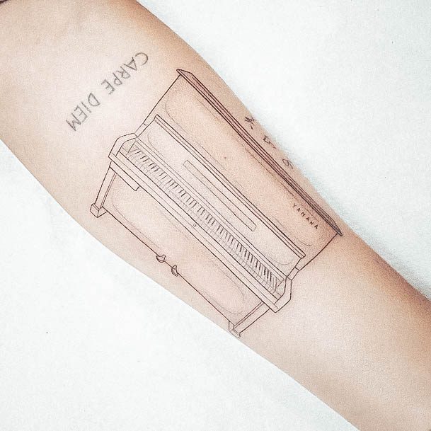 Neat Piano Tattoo On Female