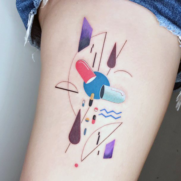 Neat Pill Tattoo On Female