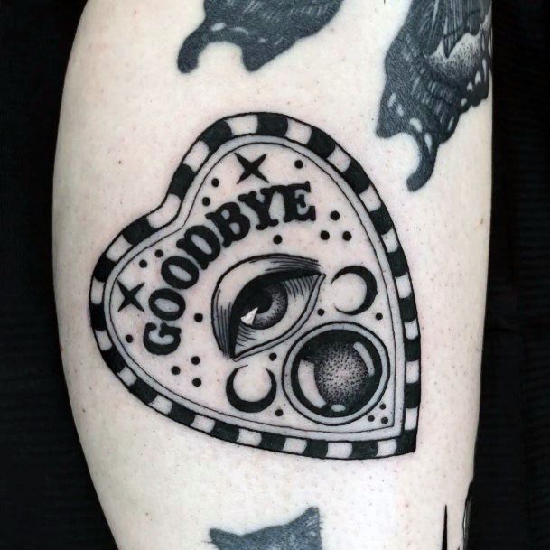 Neat Planchette Tattoo On Female