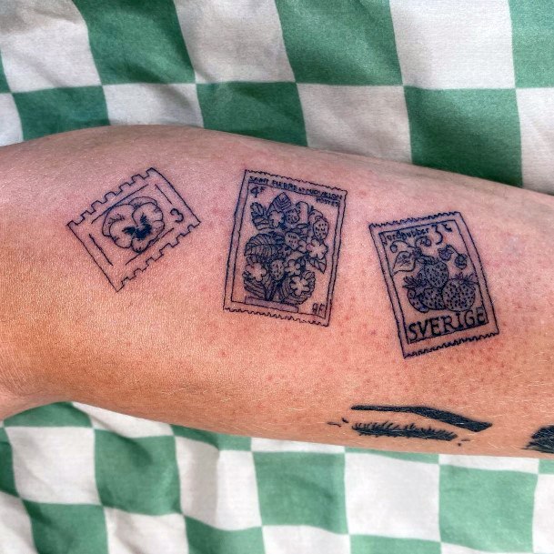 Neat Postage Stamp Tattoo On Female