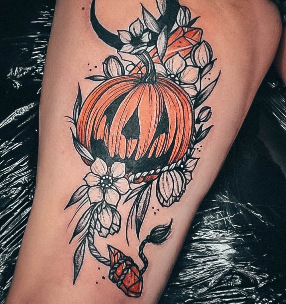 Neat Pumpkin Tattoo On Female