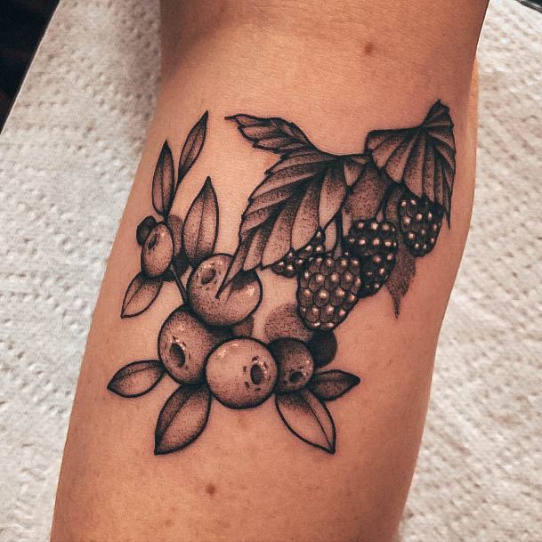 Neat Raspberry Tattoo On Female