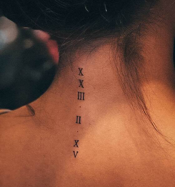 Neat Roman Numeral Tattoo On Female