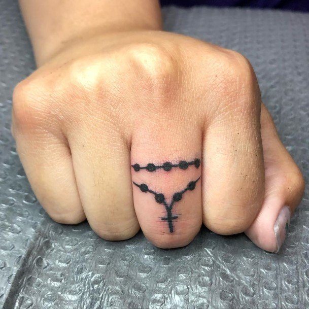 Neat Rosary Tattoo On Female Finger Band