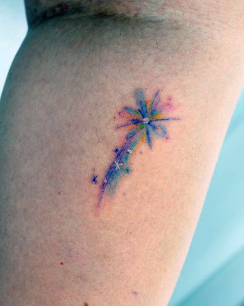 Neat Shooting Star Tattoo On Female