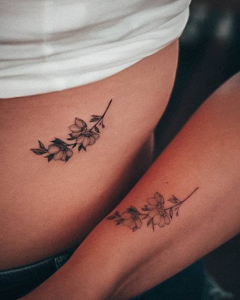 Neat Simple Flower Tattoo On Female