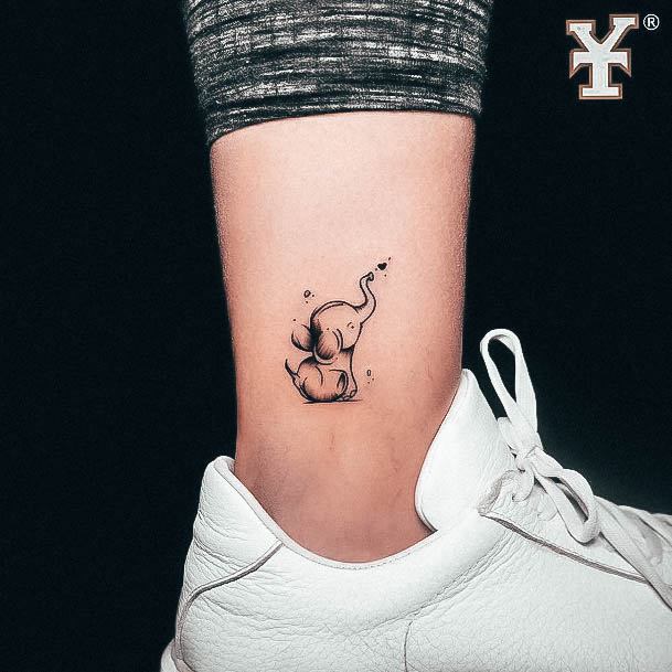 Neat Small Elephant Tattoo On Female