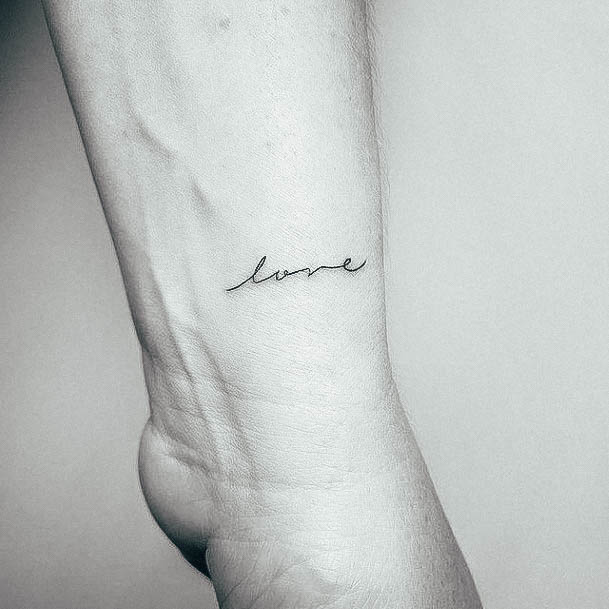 Neat Small Wrist Tattoo On Female