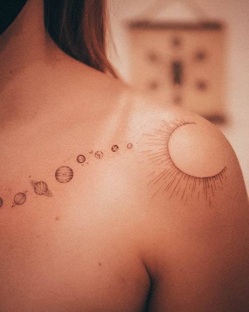 Neat Solar Tattoo On Female