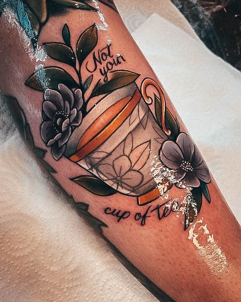 Neat Tea Tattoo On Female