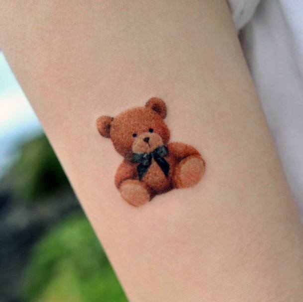 Neat Teddy Bear Tattoo On Female