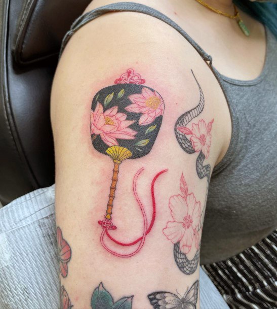 Neat Uchiwa Tattoo On Female