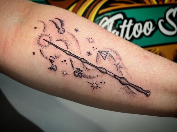 Neat Wand Tattoo On Female