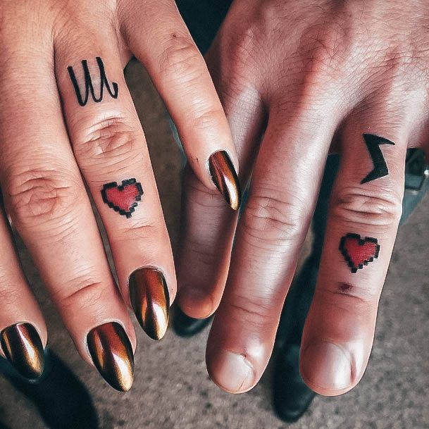 Neat Wedding Ring Tattoo On Female