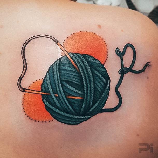 Neat Yarn Tattoo On Female