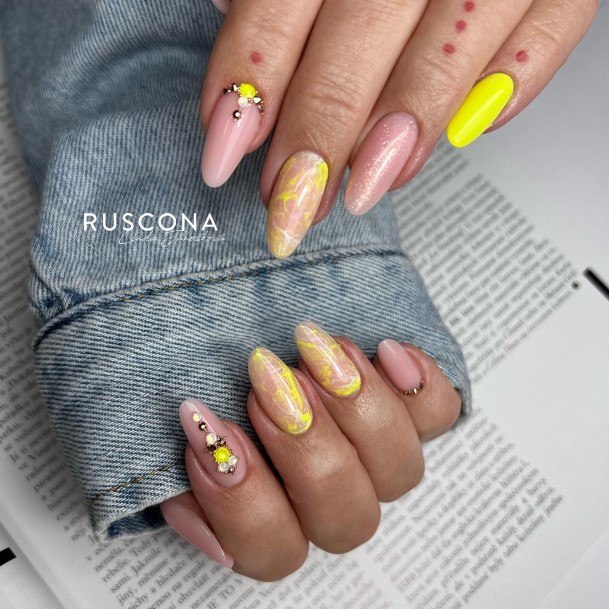 Neat Yellow With Diamonds Nail On Female